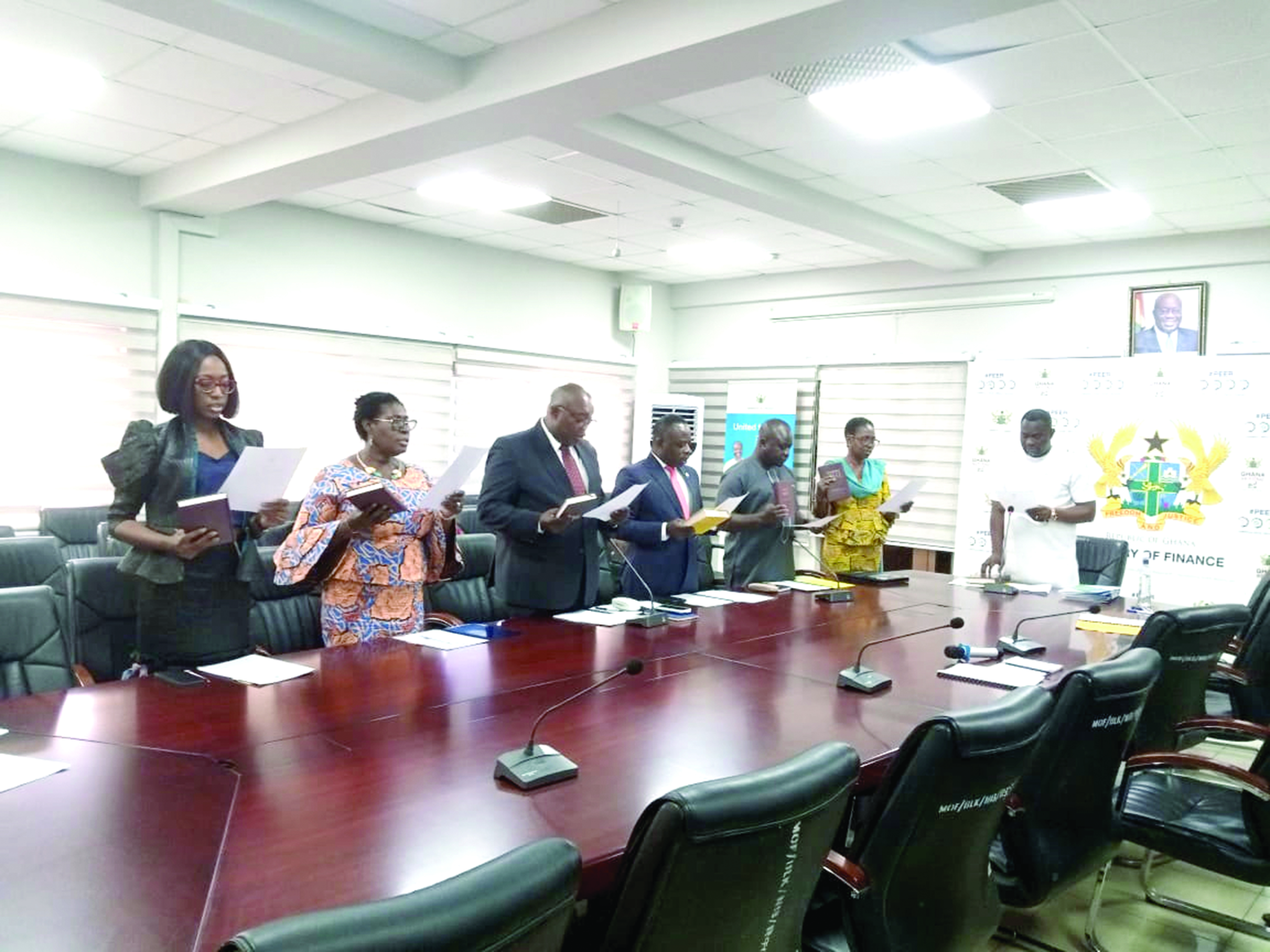 Dr John Kumah (right) swearing in the new board